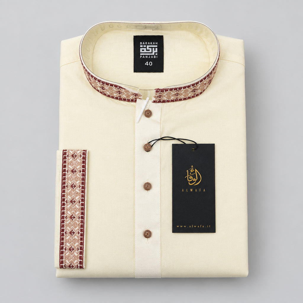 A folded cream-colored kurta with a mandarin collar and brown patterned trim, featuring a black hangtag with gold branding.