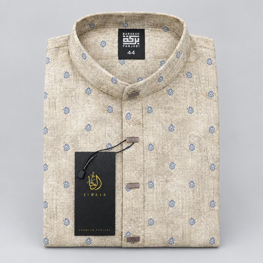 A folded men's kurta in beige cotton fabric with a subtle blue floral pattern, featuring a mandarin collar, buttoned front, and a black hangtag.